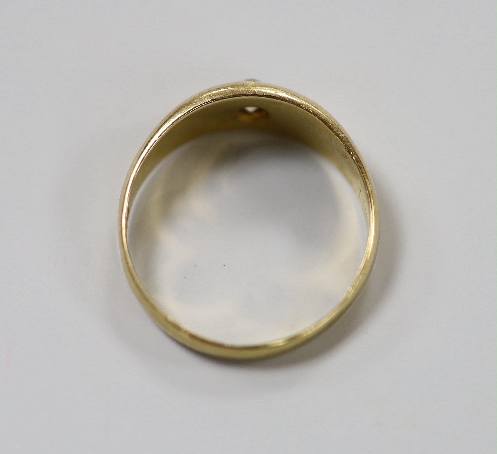 An 18ct gold and gypsy set solitaire diamond ring, size O/P, gross weight 3.9 grams.